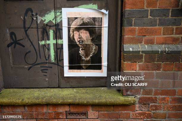 Political street art featuring a likeness of former Prime Minster Theresa May is attached to a building in the city centre of Stoke-on-Trent,...