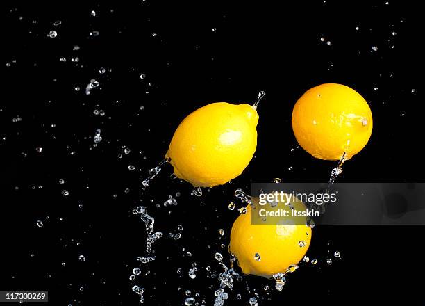 lemons - citrus splash stock pictures, royalty-free photos & images