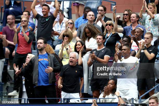 Anna Wintour, Venus Williams, coach Patrick Mouratoglou, Alexis Ohanian, and Meghan, Duchess of Sussex, cheer for Serena Williams of the United...