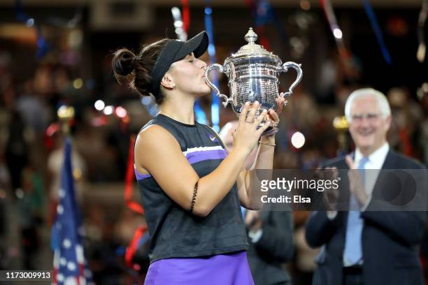 Bianca Andreescu of Canada kisses the championship trophy during the trophy presentation ceremony after winning the Women's Singles final against...