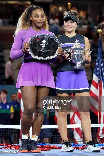 Bianca Andreescu of Canada celebrates with the championship trophy alongside runner up Serena Williams of the United States during the trophy...