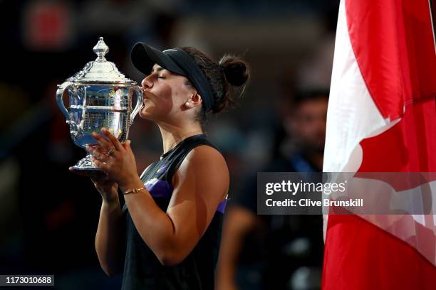 Bianca Andreescu of Canada kisses the championship trophy during the trophy presentation ceremony after winning the Women's Singles final against...