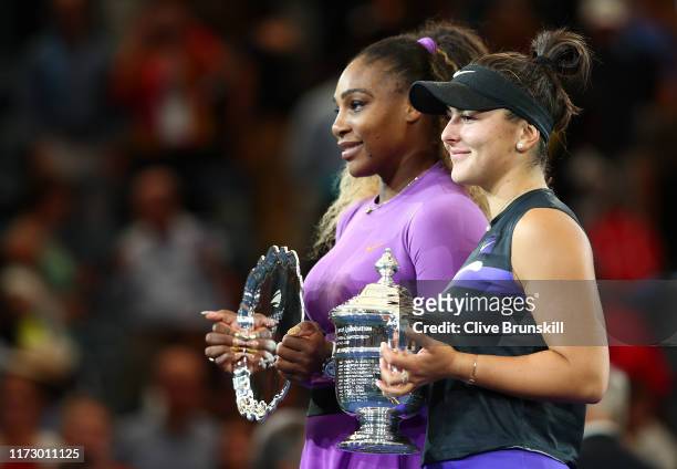 Bianca Andreescu of Canada celebrates with the championship trophy alongside runner up Serena Williams of the United States during the trophy...