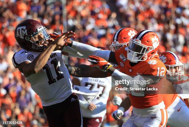 Von Wallace of the Clemson Tigers runs into Kellen Mond of the Texas A&M Aggies during their game at Memorial Stadium on September 07, 2019 in...