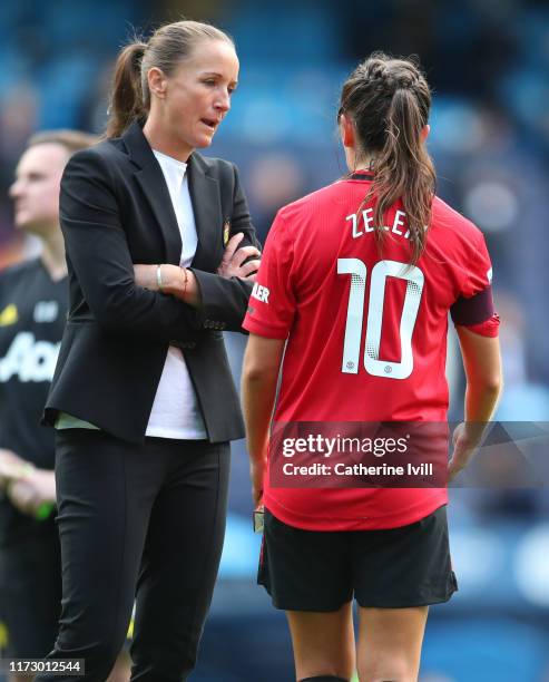 Casey Stoney manager of Manchester United speaks with Katie Zelem of Manchester United after the Barclays FA Women's Super League match between...