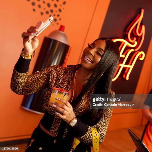 Ashanti attends The Cheetos House of Flamin’ Haute Style Bar Experience where Cheetos unveiled fan-inspired versions of the #CheetosFlaminHaute look...