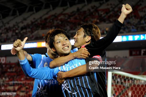 Yu Kobayashi celebrates second goal of Kawasaki Frontale with Junichi Inamoto during J.League match between Kashima Antlers and Kawasaki Frontale at...