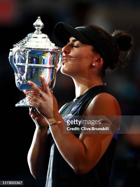 Bianca Andreescu of Canada kisses the championship trophy during the trophy presentation ceremony after winning the Women's Singles final against...