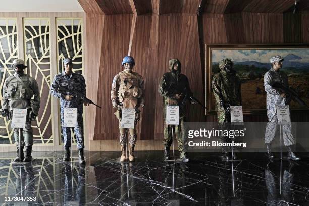 Military uniforms are displayed on mannequins at the Sri Rejeki Isman PT factory in Solo, Central Java, Indonesia, on Friday, Sept. 27, 2019. Sri...