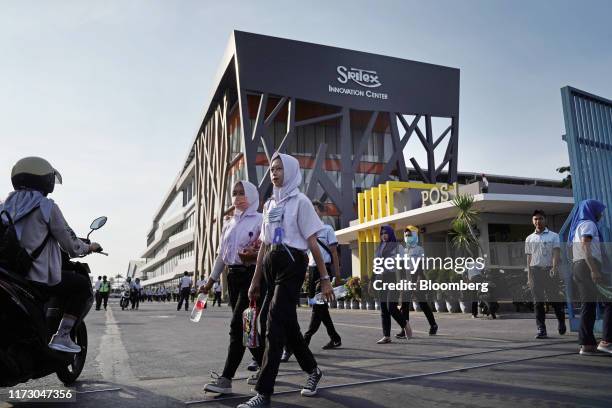 Workers exit the Sri Rejeki Isman PT factory in Solo, Central Java, Indonesia, on Friday, Sept. 27, 2019. Sri Rejeki Isman, known as Sritex, makes...