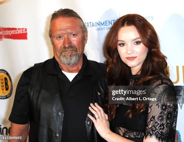 Samantha Rose Baldwin and father Michael Baldwin attend the Premiere Of "Relish" At The Burbank International Film Festival held at AMC Burbank 16 on...