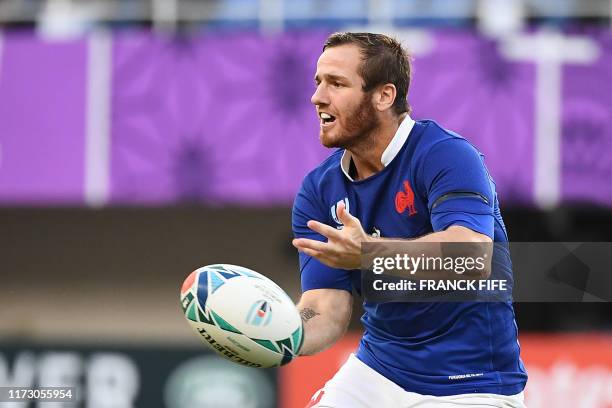 France's fly-half Camille Lopez passes the ball during the Japan 2019 Rugby World Cup Pool C match between France and the United States at the...