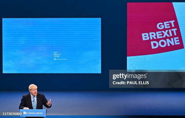 Britain's Prime Minister Boris Johnson delivers his keynote speech to delegates on the final day of the annual Conservative Party conference at the...