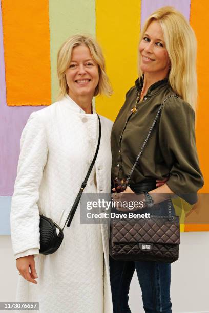 Lady Helen Taylor and Claudia Schiffer attend the Frieze Art Fair VIP Preview in Regent's Park on October 2, 2019 in London, England.