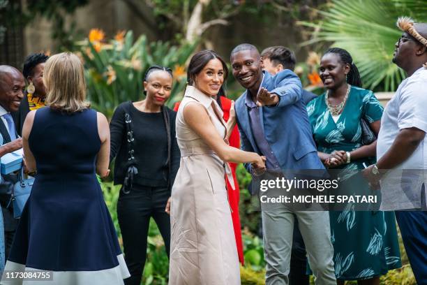 Meghan, Duchess of Sussex arrives at the British High Commissioner residency in Johannesburg where she will meet with Graca Machel, widow of former...