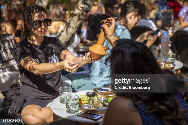 Customers pass a marijuana pipe at the Lowell Cafe, a new cannabis lounge in West Hollywood, California, U.S., on Tuesday, Oct. 1, 2019. America's...