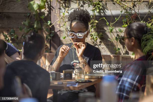 Customer smokes marijuana at the Lowell Cafe, a new cannabis lounge in West Hollywood, California, U.S., on Tuesday, Oct. 1, 2019. America's first...