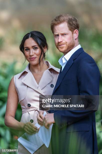Britain's Prince Harry, Duke of Sussex and Meghan, the Duchess of Sussex arrive at the British High Commissioner residency in Johannesburg where they...
