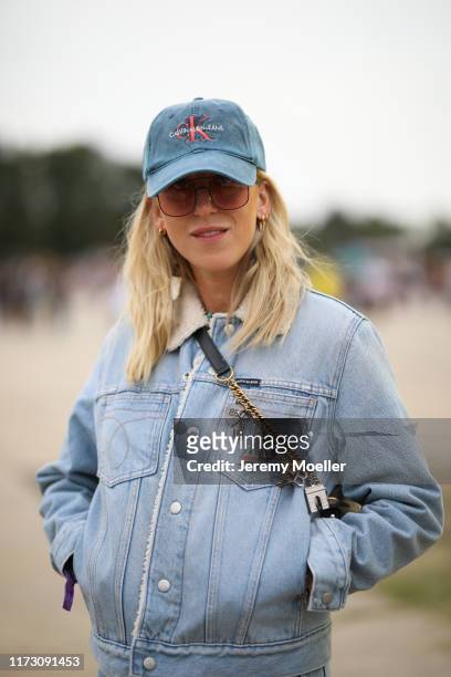 Tanja Trutschnig wearing Calvin Klein jacket and hat and a Balenciaga beltbag on September 07, 2019 in Berlin, Germany.