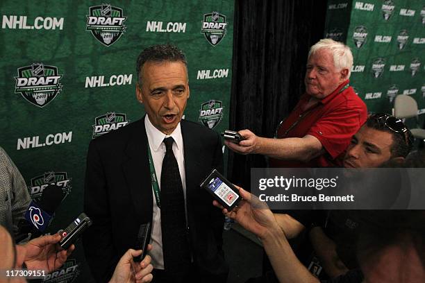 General manager Pierre Gauthier of the Montreal Canadiens answers questions after day two of the 2011 NHL Entry Draft at Xcel Energy Center on June...