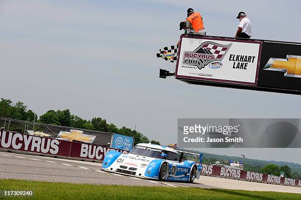 Scott Pruett/Memo Rojas, drivers of the Chip Ganassi Racing with Felix Sabates BMW Riley crosses the finish line to win the GRAND-AM Rolex Series...