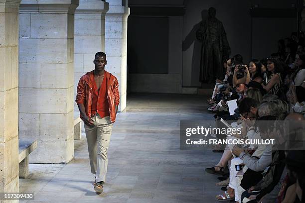 Model presents a creation by french designer Veronique Nichanian for the Hermes label during the brand men's spring-summer 2012 fashion collection...