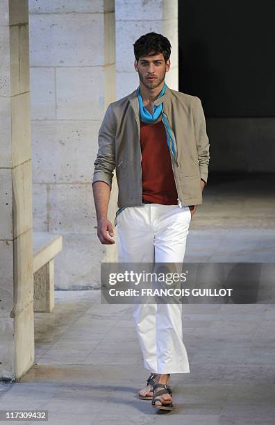 Model presents a creation by french designer Veronique Nichanian for the Hermes label during the brand men's spring-summer 2012 fashion collection...