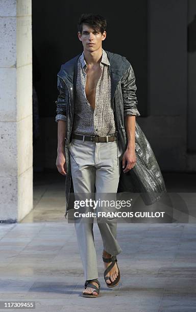 Model presents a creation by french designer Veronique Nichanian for the Hermes label during the brand men's spring-summer 2012 fashion collection...