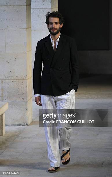 Model presents a creation by french designer Veronique Nichanian for the Hermes label during the brand men's spring-summer 2012 fashion collection...