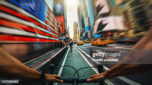 pov bicycle riding: road racing bike in new york - bicycle messenger stock pictures, royalty-free photos & images