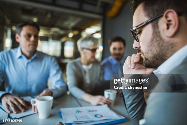 thoughtful male candidate having a job interview. - disappoint bussiness meeting stock pictures, royalty-free photos & images