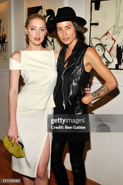 Amber Heard and Tasya Van Ree attend Tasya Van Ree's private viewing of "Distorted Delicacies" at Vs. Magazine & Creative Studios Paris' Space on...