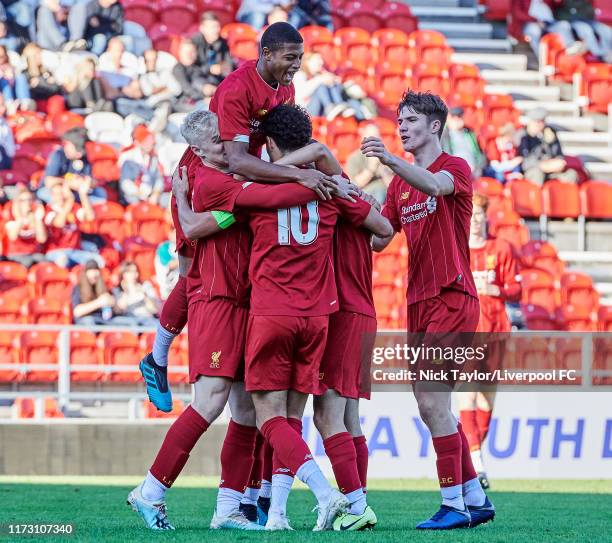 Curtis Jones of Liverpool celebrates scoring Liverpool's third goal with team mates Luis Longstaff, Rhian Brewster and Morgan Boyes during the UEFA...