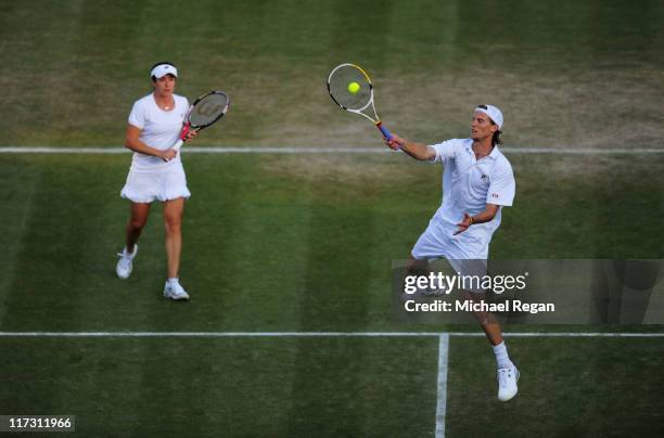 Alberta Brianti and Andreas Seppi of Italyin action during their first round mixed double's matchagainst Jonathan Marray and Anne Keothavong of Great...