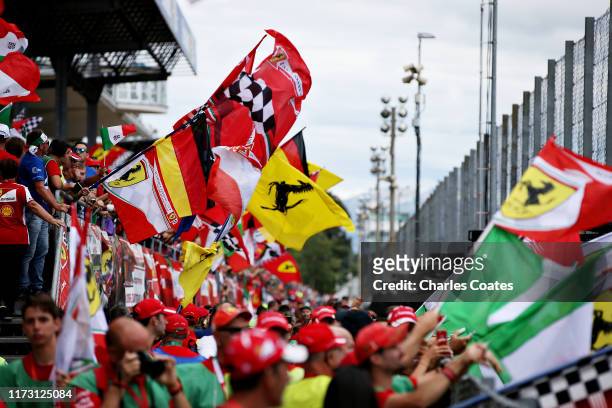 Ferrari fans wave flags to show their support before the F1 Grand Prix of Italy at Autodromo di Monza on September 08, 2019 in Monza, Italy.