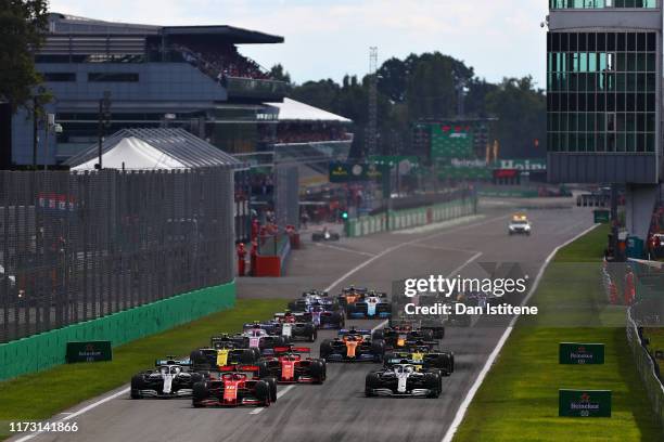 Charles Leclerc of Monaco driving the Scuderia Ferrari SF90 leads the field at the start during the F1 Grand Prix of Italy at Autodromo di Monza on...