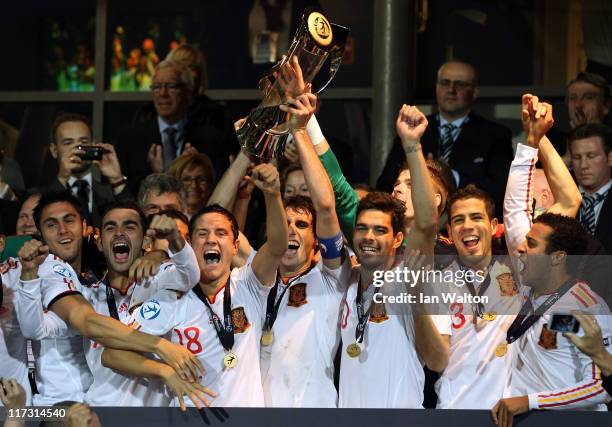 Javi Martinez, the captain of Spain, lifts the winners trophy after his side's 2-0 victory after their UEFA European U21 Championship Final match...