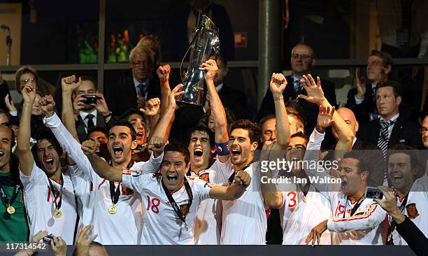 Javi Martinez, the captain of Spain, lifts the winners trophy after his side's 2-0 victory after their UEFA European U21 Championship Final match...