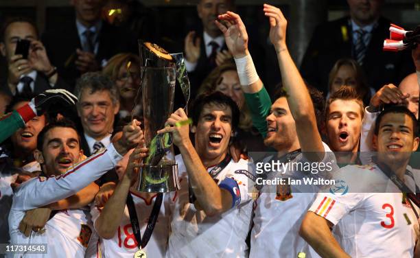Javi Martinez, the captain of Spain, lifts the winners trophy after his side's 2-0 victory after their UEFA European U21 Championship Final match...