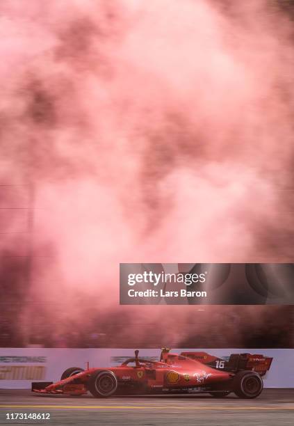 Race winner Charles Leclerc of Monaco driving the Scuderia Ferrari SF90 celebrates during the F1 Grand Prix of Italy at Autodromo di Monza on...