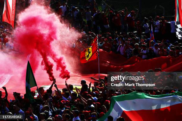 Ferrari fans enjoy the atmosphere at the podium during the F1 Grand Prix of Italy at Autodromo di Monza on September 08, 2019 in Monza, Italy.