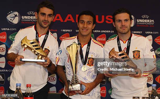 Adrian Lopez winner of the golden boot alongside Thiago Alcantara man of the match and Juan Mata bronze boot winnerall representing Spain after the...