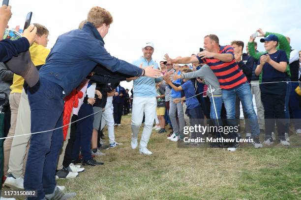 Paul Casey of England celebrates with fans following Day 4 of the Porsche European Open at Green Eagle Golf Course on September 08, 2019 in Hamburg,...