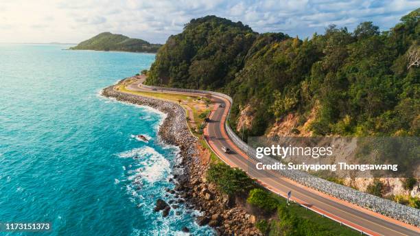 aerial view highway road along the sea. - summer driving stock pictures, royalty-free photos & images