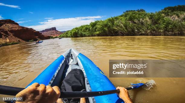 pov  rafting with kayak in colorado river, moab - moab rafting stock pictures, royalty-free photos & images