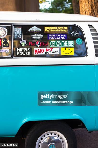 santa fe, nm: vintage vw van covered with bumper stickers - bumper sticker stock pictures, royalty-free photos & images
