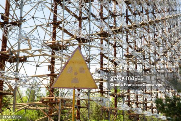 radioactive warning symbol in the chernobyl exclusion zone - chernobyl stock pictures, royalty-free photos & images