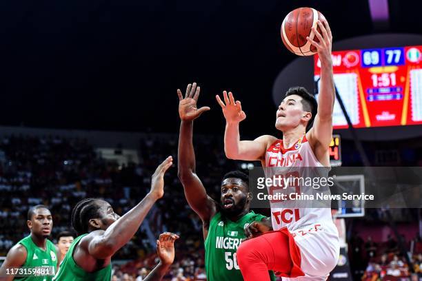Abudushalamu Abudurexiti of China goes to the basket against Micheal Eric of Nigeria during FIBA World Cup 2019 Group M match between China and...