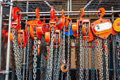 Multiple chain hoists hanging in a rack