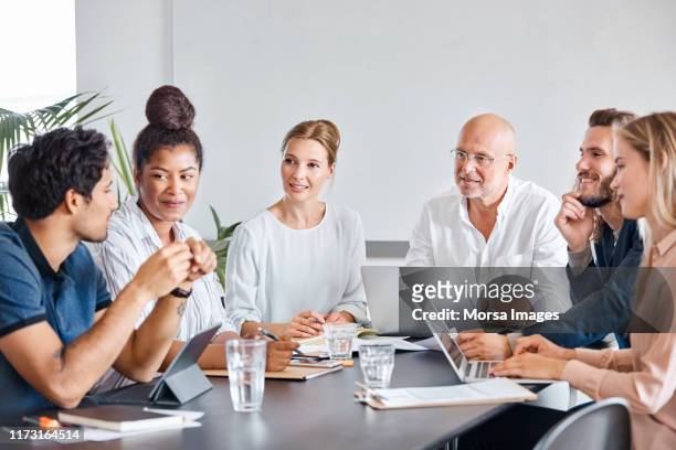 business professionals planning in meeting - medium group of people stock pictures, royalty-free photos & images